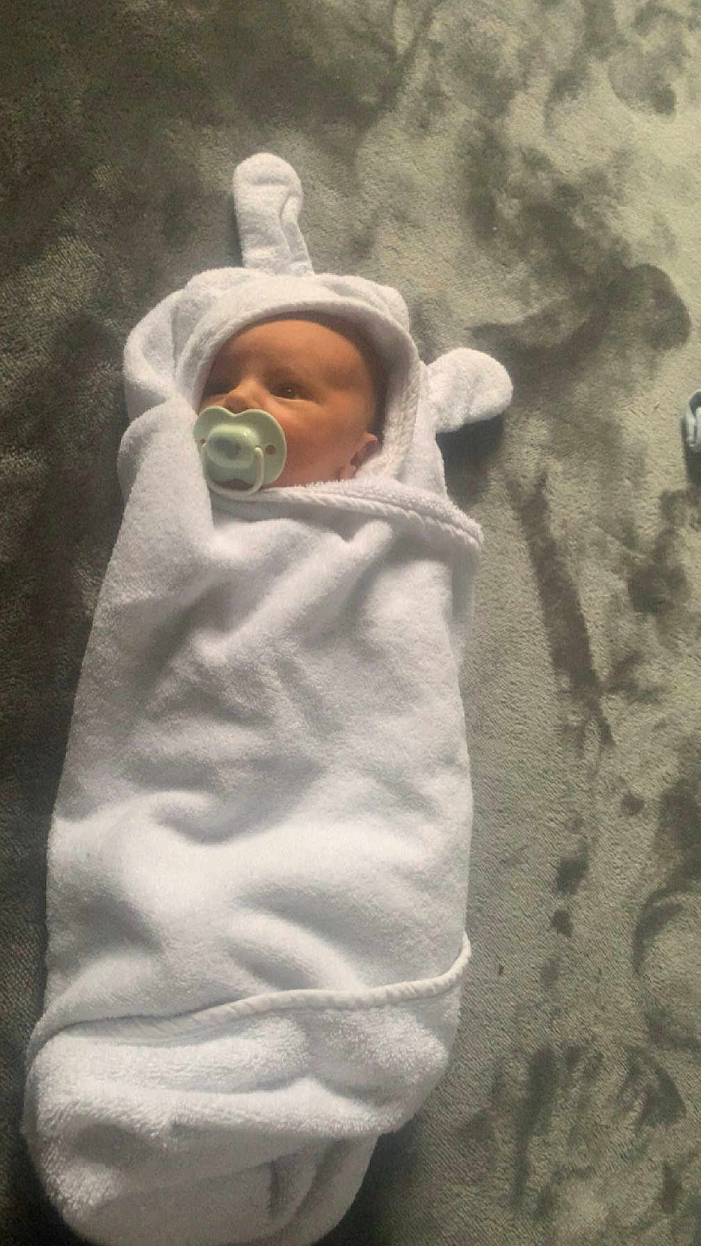Kylo joined the competition — help win amazing prizes! baby, pacifier, towel, white, wrapped, carpet, floor, infant, cute, soft, newborn, child, hooded_towel, indoor, portrait, lying_down, baby_girl, baby_boy, blanket, cozy