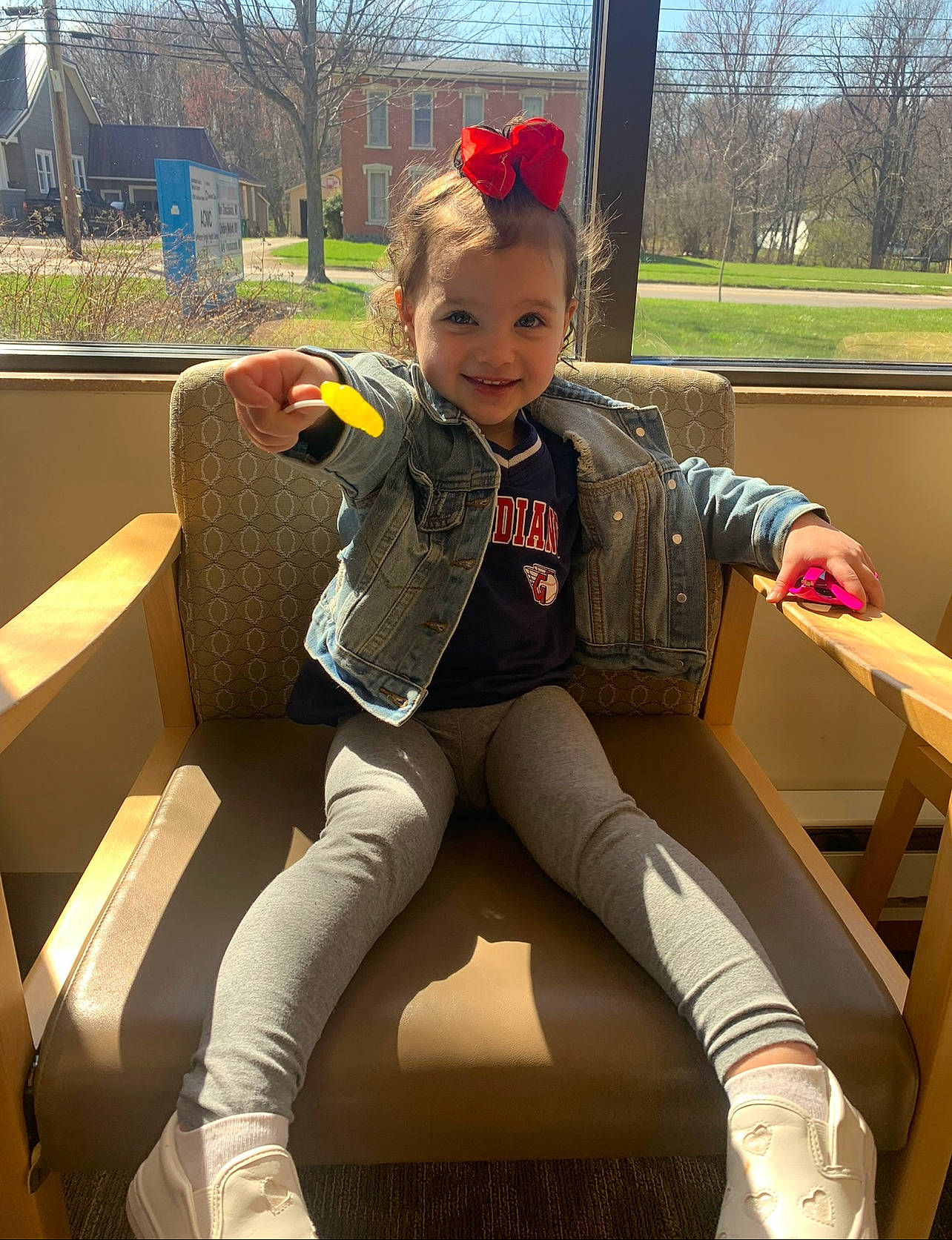 Aria is registered to the contest to win money with this photo: blond, cool, facial_expression, fun, grass, happy, human_leg, joy, knee, lap, leisure, person, plant, shoe, sitting, sky, sleeve, smile, snapshot, sneakers