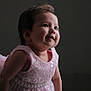 Deyna is registered to the contest to win money with this photo: baby, child, girl, pink_dress, pearl_belt, smile, portrait, cute, happy, indoors, dark_background, soft_lighting, closeup, infant, young_child, fashion, elegant, face, expression, happiness