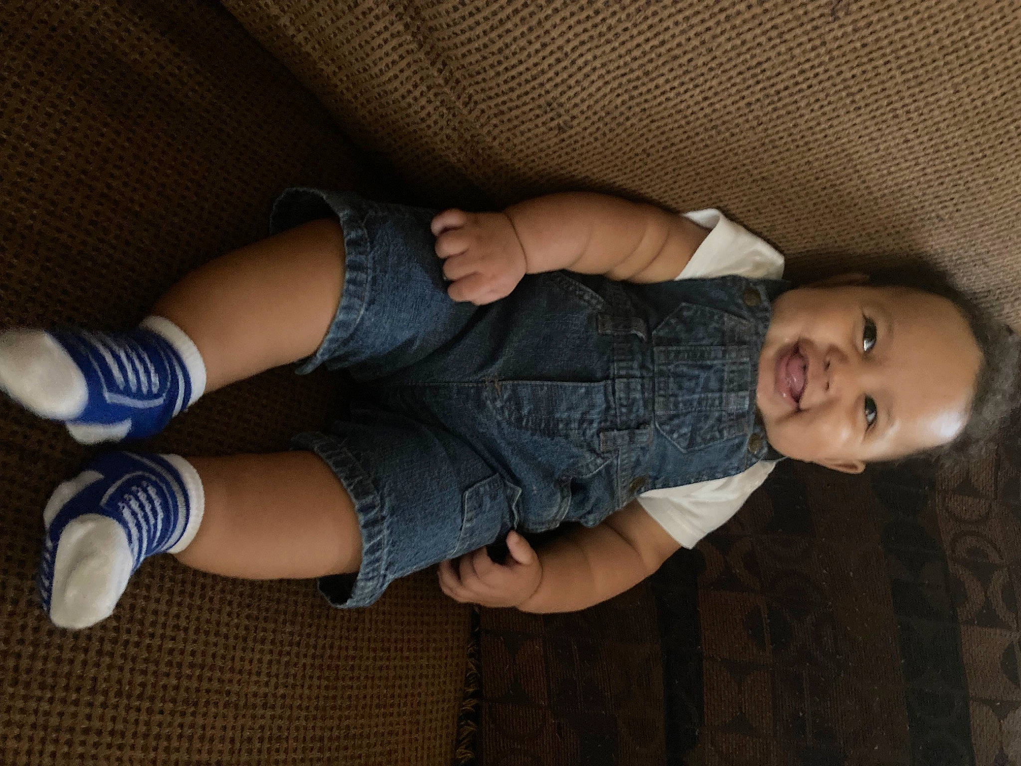 Alexander is registered to the contest to win money with this photo: baby_toddler_clothing, calf, comfort, denim, elbow, finger, foot, human_body, human_leg, joint, joy, knee, leg, nail, pattern, person, smile, sock, textile, thigh