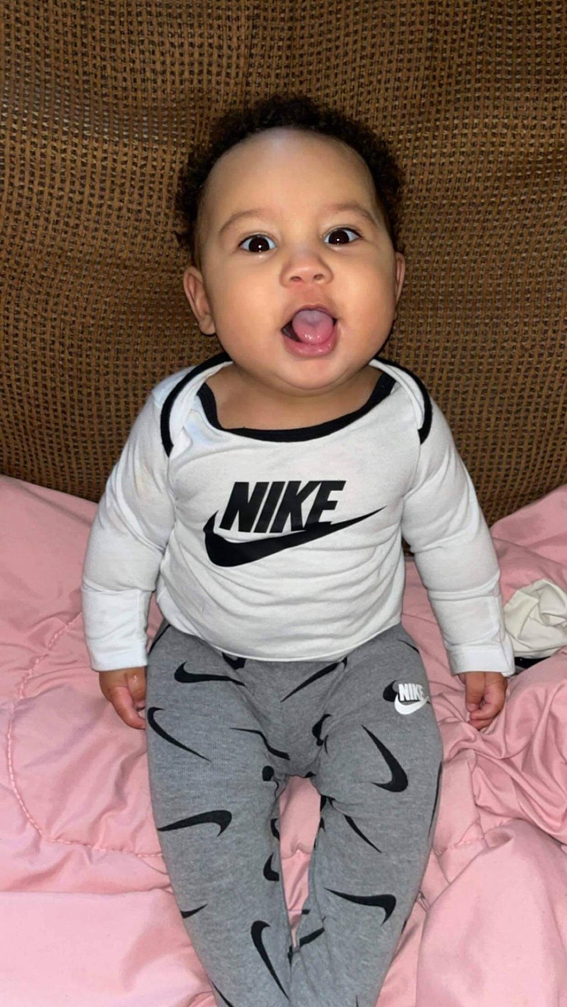 Alexander is registered to the contest to win money with this photo: baby, baby_toddler_clothing, cheek, child, comfort, eye, face, happy, head, linens, monochrome_photography, pattern, person, product, sitting, skin, sleeve, smile, t_shirt, toddler