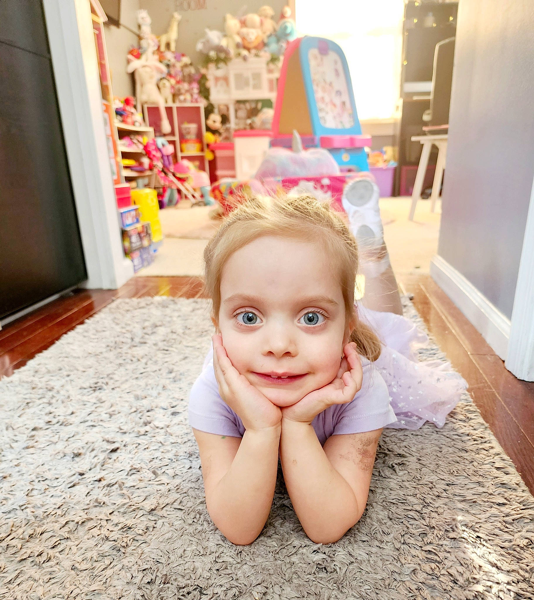 Peyton joined the competition — help win amazing prizes! baby, barefoot, blond, child, floor, flooring, foot, fun, happy, human_body, human_leg, iris, joy, leg, leisure, person, sitting, smile, standing, thigh