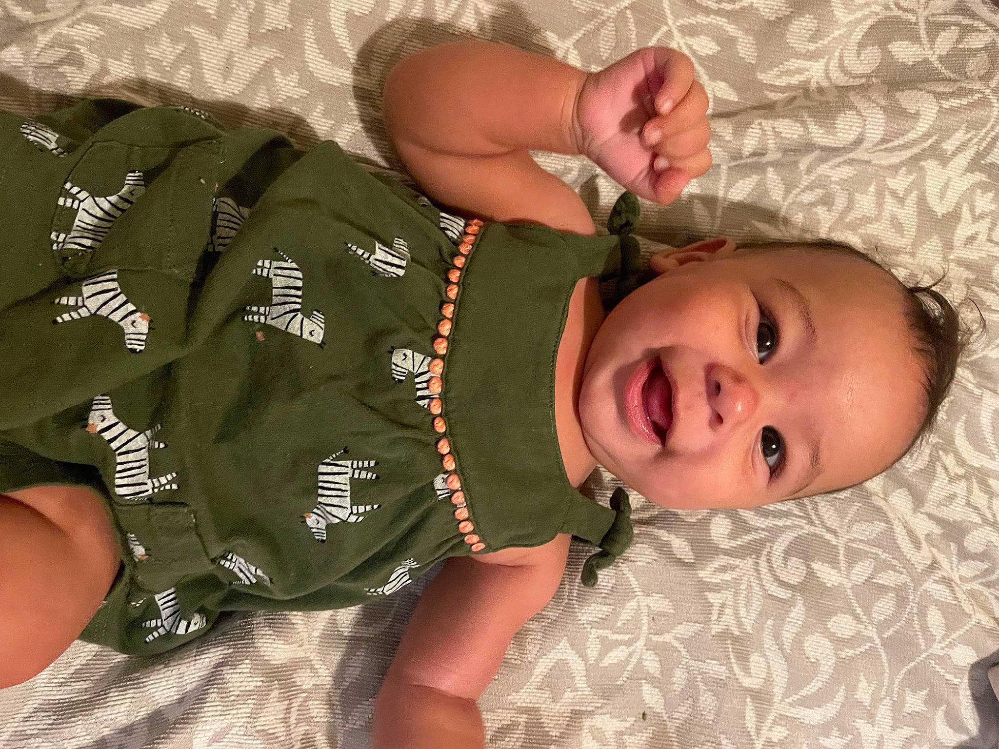 Kalani joined the competition — help win amazing prizes! baby, baby_toddler_clothing, cheek, child, comfort, elbow, finger, gesture, hair, hand, happy, head, human_body, military_camouflage, mouth, person, skin, sleeve, smile, thumb