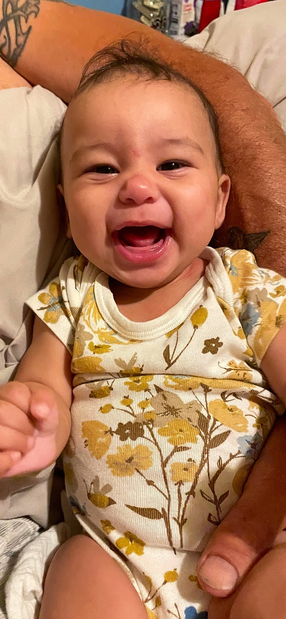 Kalani is registered to the contest to win money with this photo: baby, baby_toddler_clothing, cheek, chin, eye, face, facial_expression, finger, gesture, happy, head, iris, lip, mouth, neck, nose, person, pink, skin, sleeve