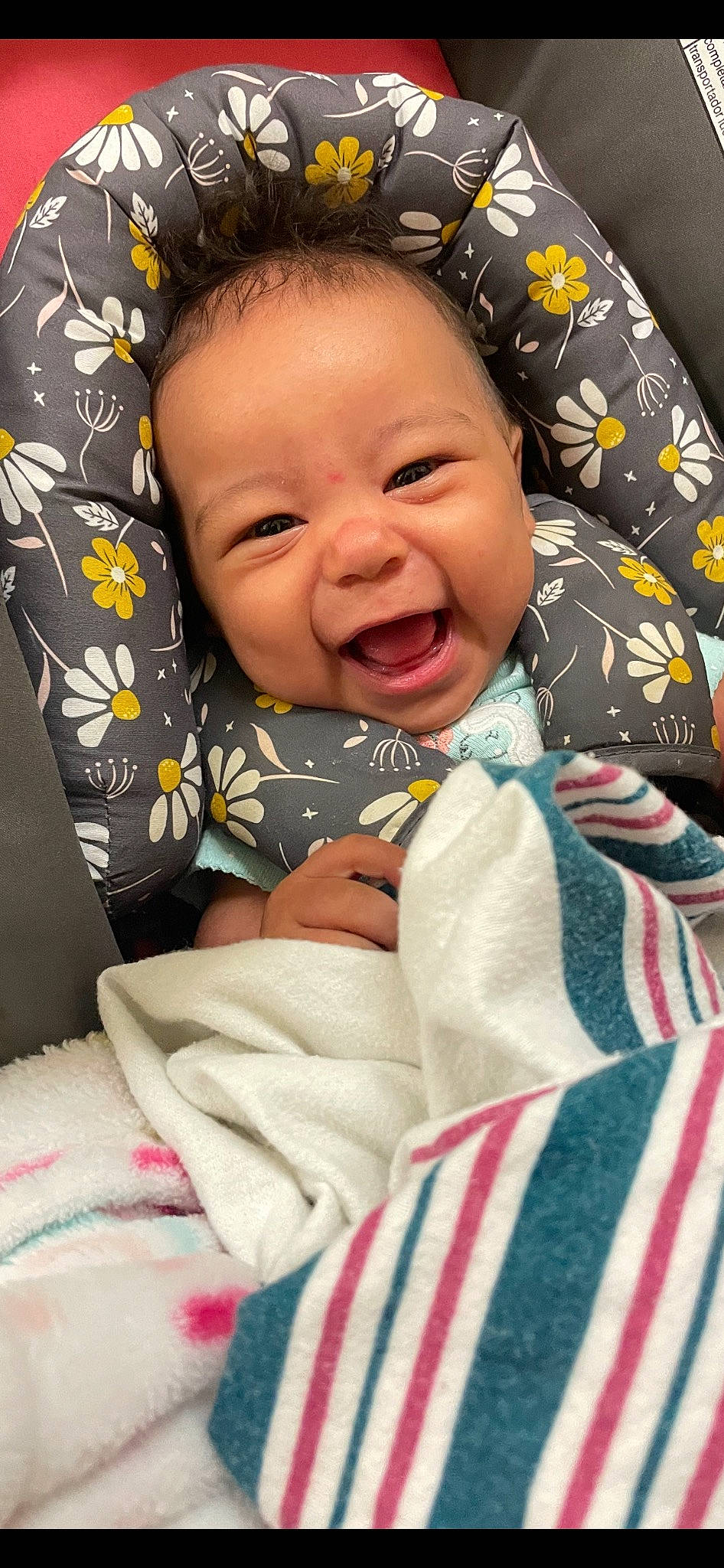 Kalani is registered to the contest to win money with this photo: baby, baby_laughing, baby_products, baby_toddler_clothing, bedding, bedtime, blanket, cheek, child, comfort, happy, laugh, linens, pattern, person, room, skin, sleeve, smile, textile