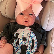Lainey joined the competition — help win amazing prizes! baby, infant, car_seat, pink_bow, headband, bracelet, clothing, seatbelt, fabric, cute, portrait, child, sitting, closeup, face, skin, apparel, comfort, indoor, accessory