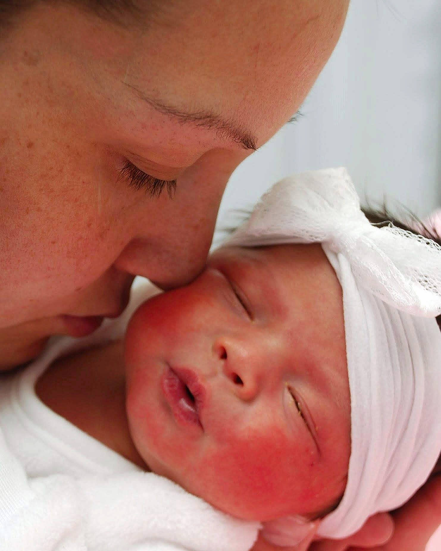 Zoey is registered to the contest to win money with this photo: bedtime, cheek, child, childbirth, close_up, ear, face, forehead, headwear, infant, lip, mother, mouth, nose, person, product, skin, sleep