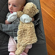 Elodie is registered to the contest to win money with this photo: baby, infant, teddy_bear, mittens, pink_booties, baby_seat, quilted_fabric, wooden_floor, cute, soft_toy, newborn, clothing, indoor, person, child, comfort, portrait, expression, handwear, footwear