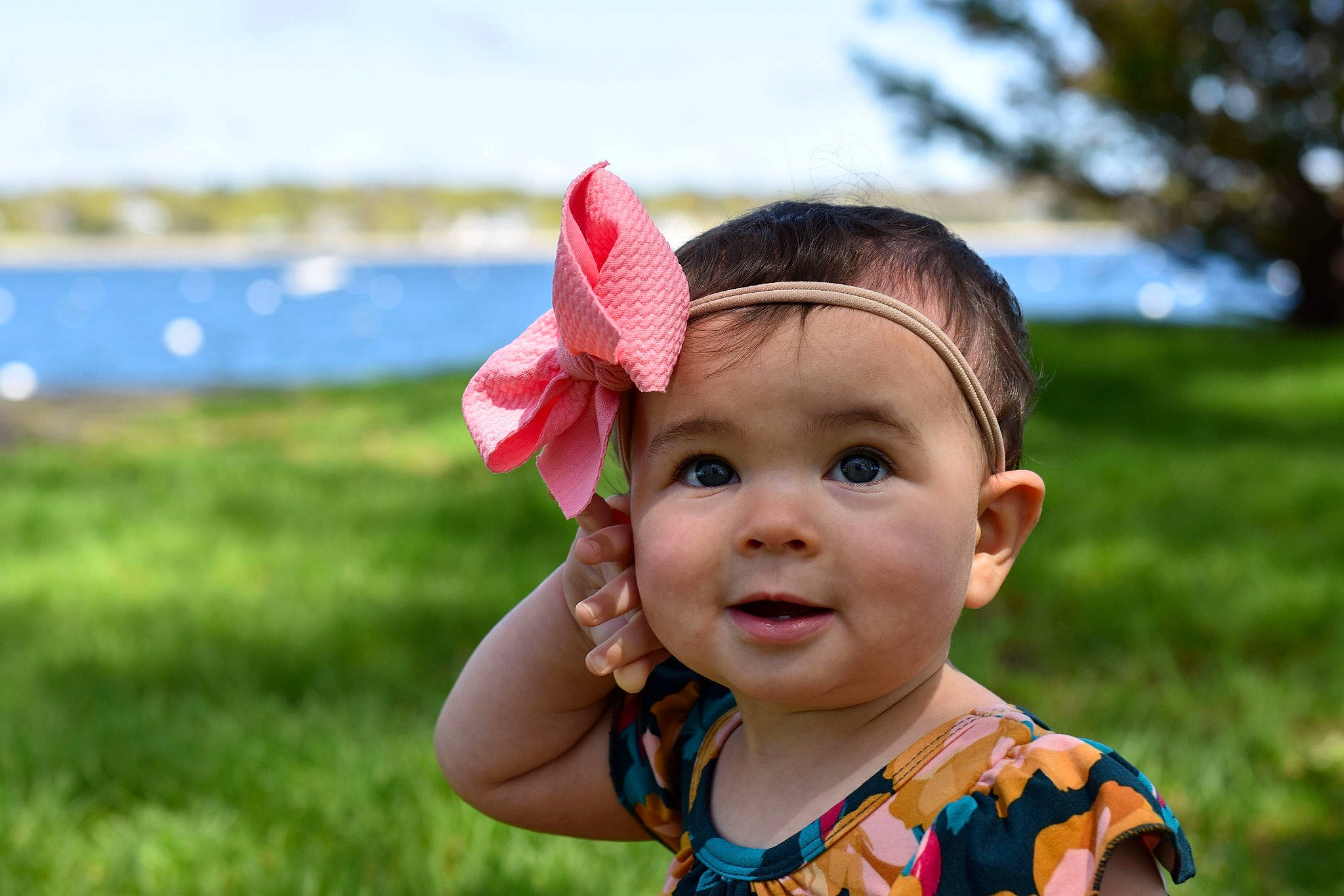 Eviana is registered to the contest to win money with this photo: baby, cheek, child, ear, face, fashion_accessory, fun, grass, hair_accessory, happy, hat, head, headgear, person, pink, skin, smile, summer, sun_hat, toddler
