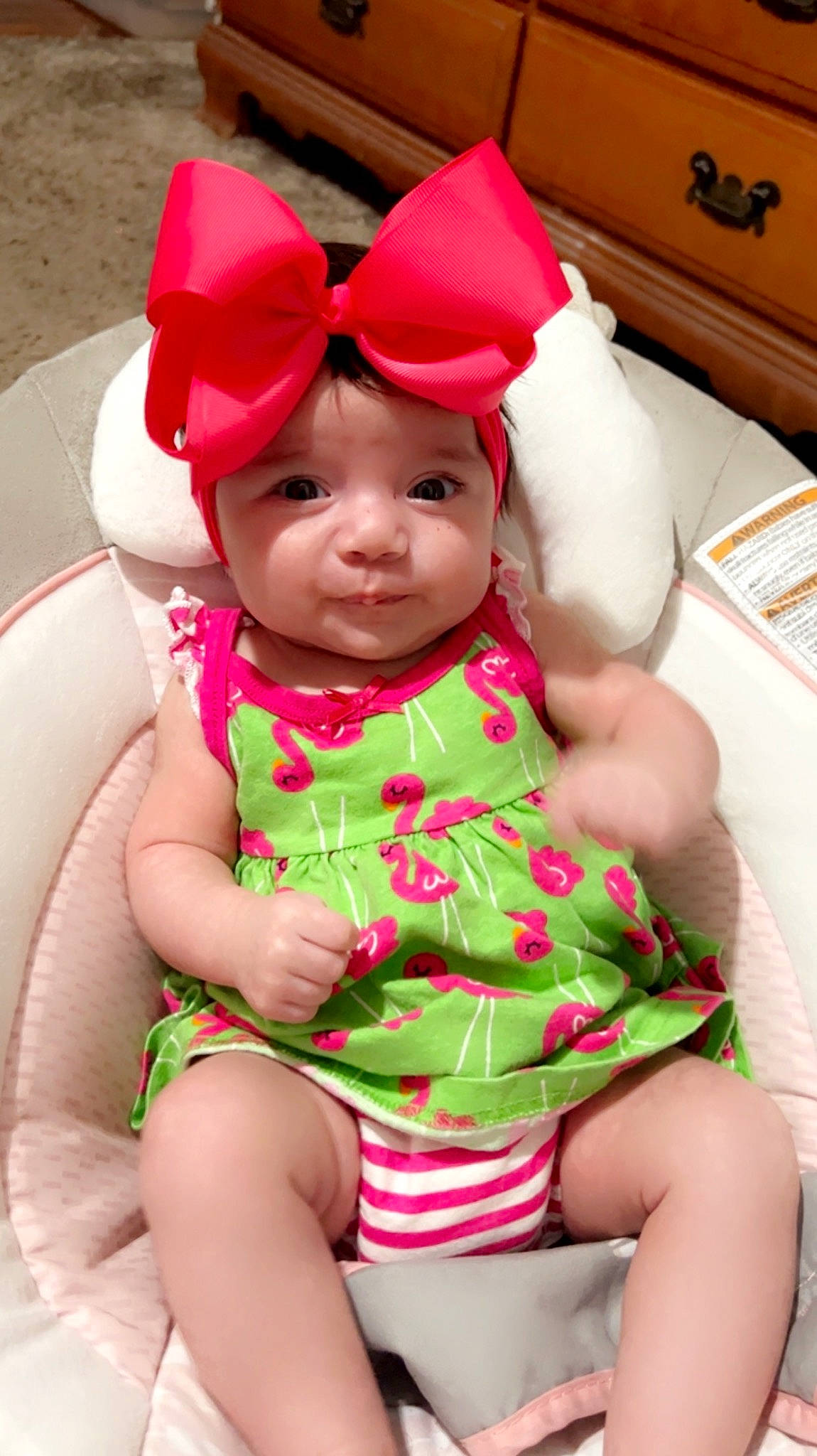 Adalyn is registered to the contest to win money with this photo: baby, baby_toddler_clothing, cap, cheek, child, comfort, dress, face, fun, happy, head, headwear, human_body, human_leg, leisure, magenta, person, pink, red, skin