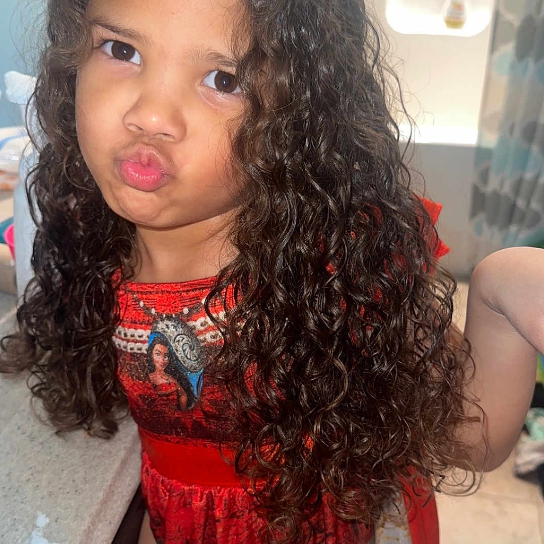 Alaina is registered to the contest to win money with this photo: blackhair, bodypart, child, clothing, cosmetics, curlyhair, dress, eveningdress, face, female, finger, girl, hair, hand, head, lipstick, mouth, person, photography, portrait