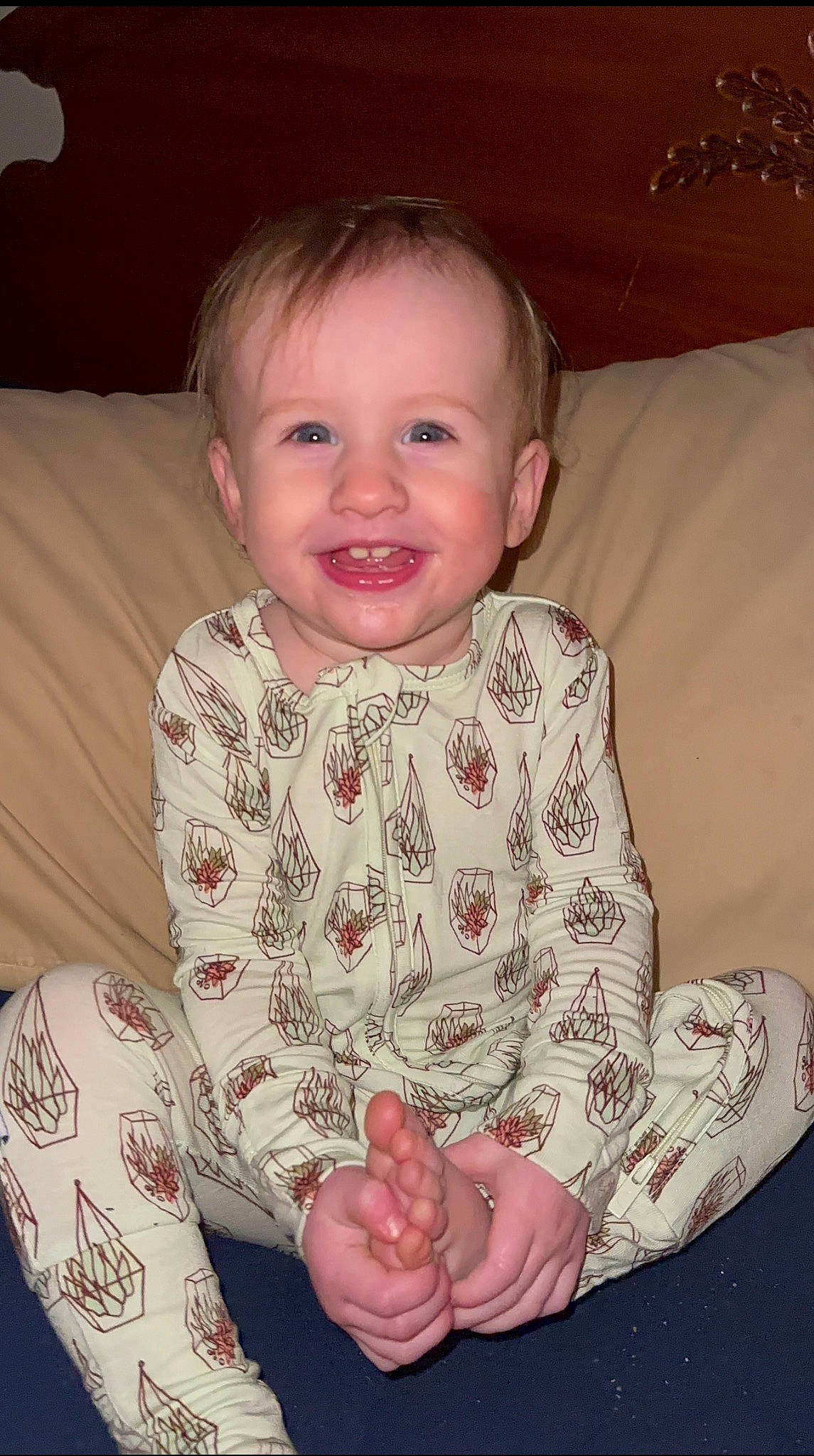 Christian is registered to the contest to win money with this photo: baby, baby_toddler_clothing, cheek, comfort, couch, eye, finger, gesture, hand, happy, iris, joy, linens, neck, nose, person, pink, skin, sleeve, smile