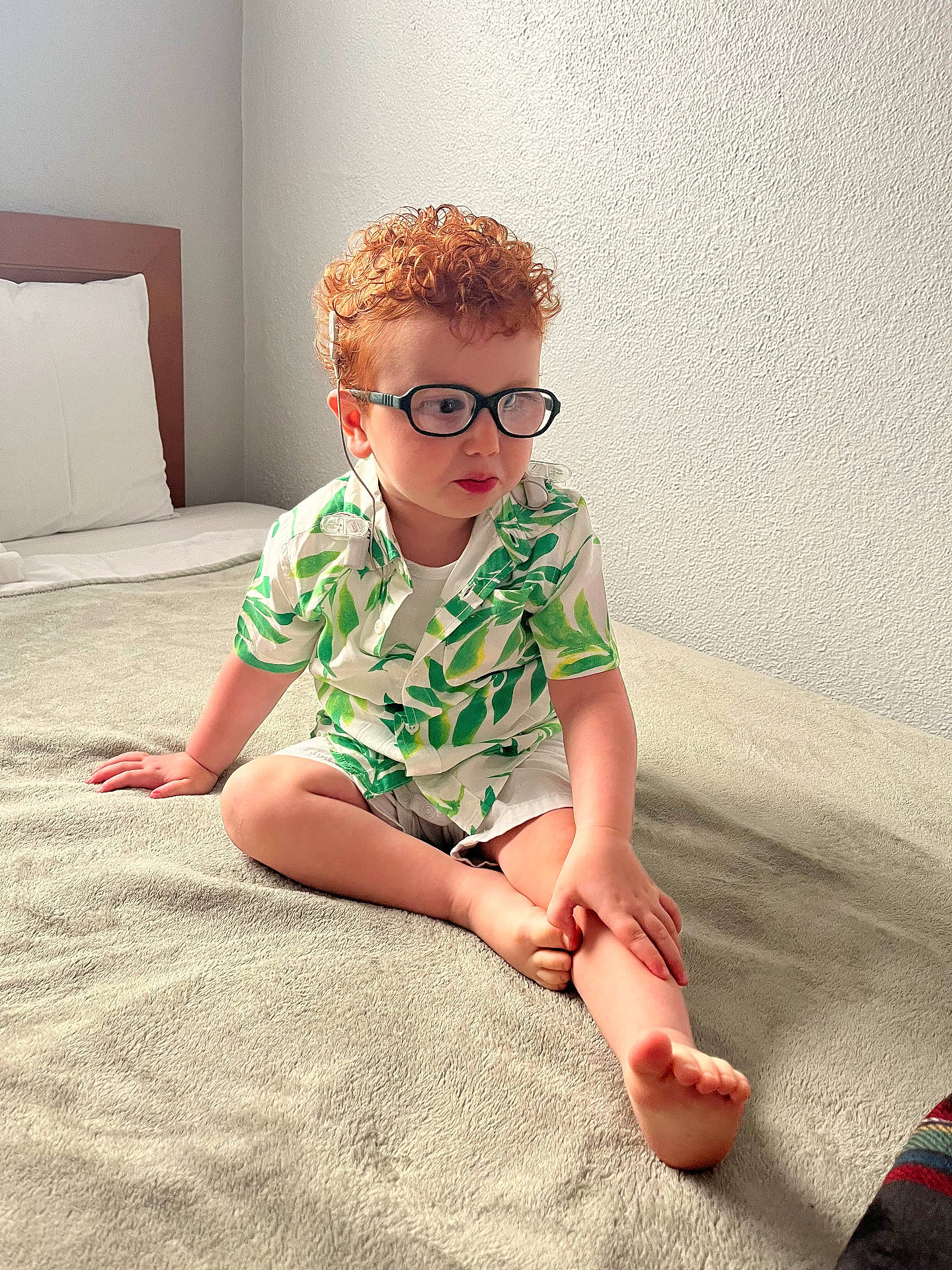 Saul is registered to the contest to win money with this photo: accessories, blonde, boy, child, clothing, curlyhair, face, fitness, glasses, hair, head, male, person, photography, portrait, sitting, sleeve, sport, workingout, yoga