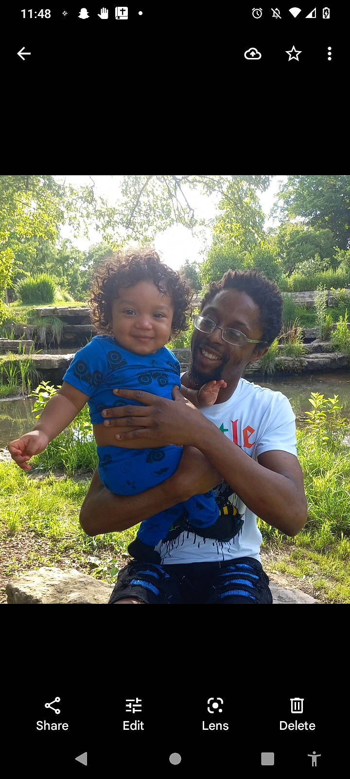 Vincent Jr joined the competition — help win amazing prizes! arm, flash_photography, fun, gesture, grass, green, happy, joy, landscape, leisure, people, people_in_nature, person, plant, recreation, shirt, sitting, smile, t_shirt, toddler