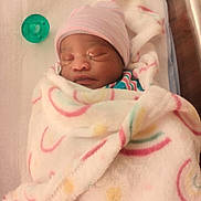 Miracle joined the competition — help win amazing prizes! newborn, baby, sleeping, blanket, hospital_bed, pacifier, hat, infant, wrapped, cute, child, soft, peaceful, face, closeup, indoors, person, resting, newborn_baby, cozy