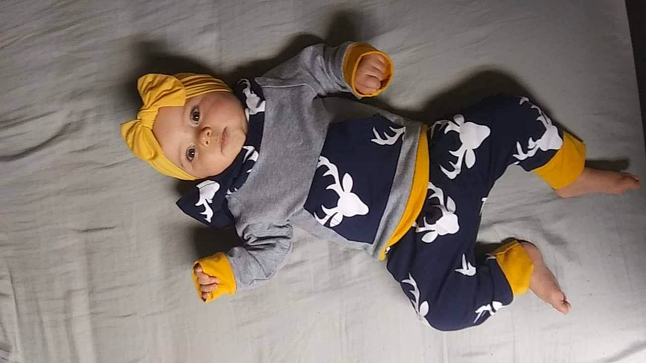 Juniper is registered to the contest to win money with this photo: child, headwear, outerwear, person, smile