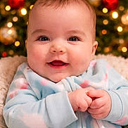 Kinsley joined the competition — help win amazing prizes! baby, infant, smiling, face, hands, onesie, cozy, pastel_colors, christmas_tree, holiday, bokeh, indoor, cute, child, portrait, happy, soft_lighting, warm_colors, closeup, festive