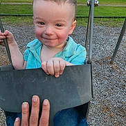 Landyn Scott joined the competition — help win amazing prizes! blue_shirt, child, daylight, fun, grass, hand, happy, jeans, metal_chain, nature, outdoor, park, person, playground, seat, smile, swing, toddler, trees, wood_chips
