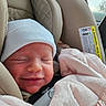 Alaina is registered to the contest to win money with this photo: baby, beige, blanket, car_seat, child, clothing, comfort, cute, face, hat, indoors, infant, newborn, portrait, relaxation, safety, seatbelt, sleeping, smile, soft_texture