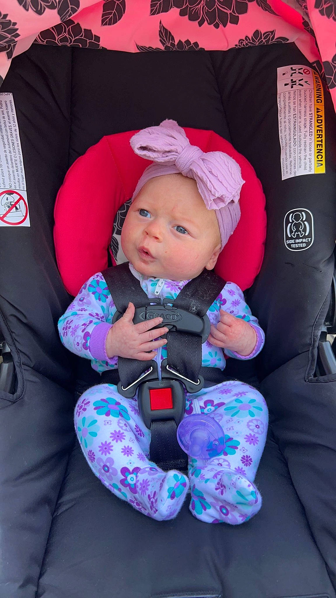 Camryn is registered to the contest to win money with this photo: baby, baby_carriage, baby_in_car_seat, baby_products, baby_safety, baby_toddler_clothing, car_seat, cheek, child, comfort, electric_blue, fun, lap, magenta, person, pink, purple, sitting, sleeve, toddler