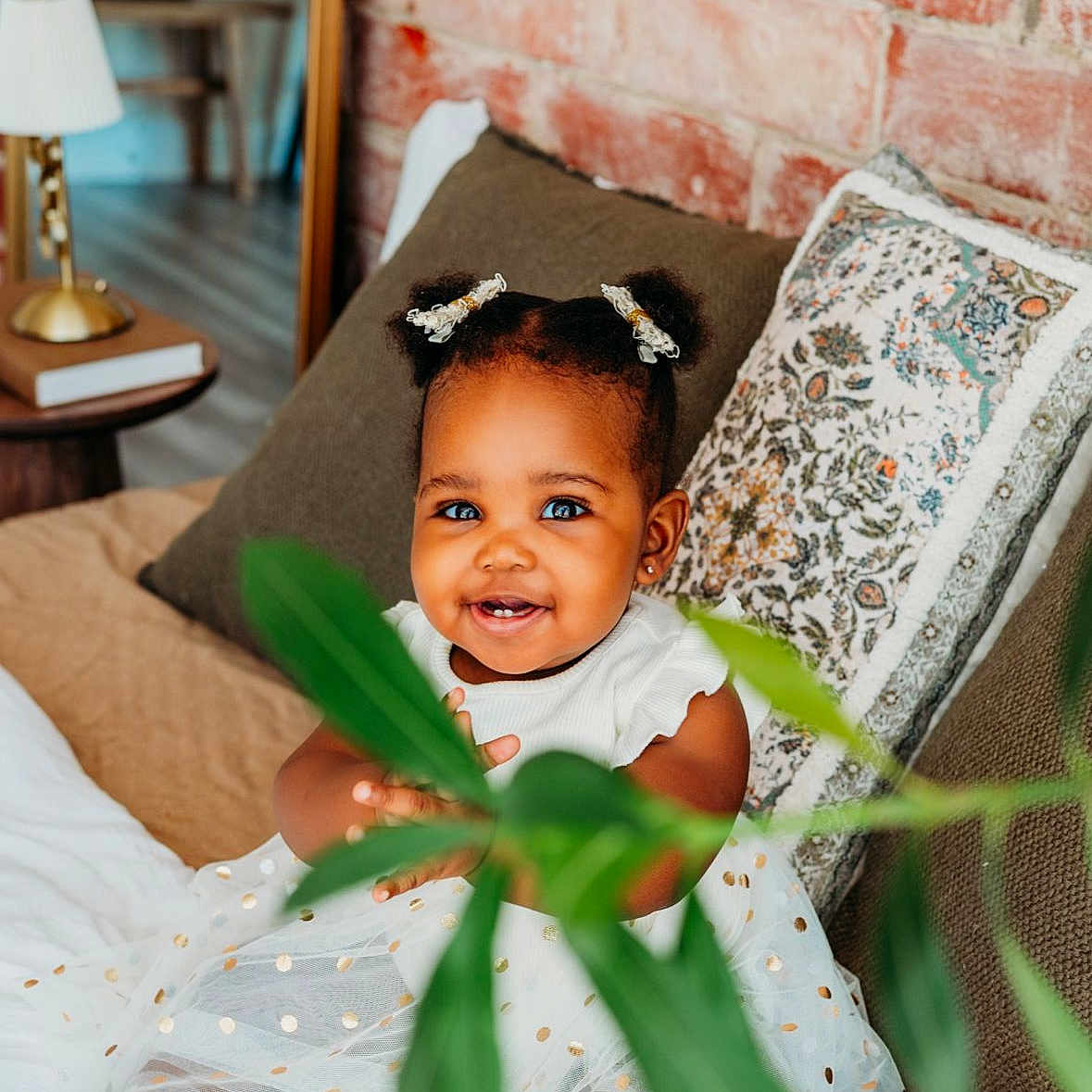 Yanna joined the competition — help win amazing prizes! baby, babylaughing, blackhair, blanket, clothing, cushion, face, hair, happy, head, homedecor, lamp, person, photography, pillow, portrait, sitting, sleeve, smile