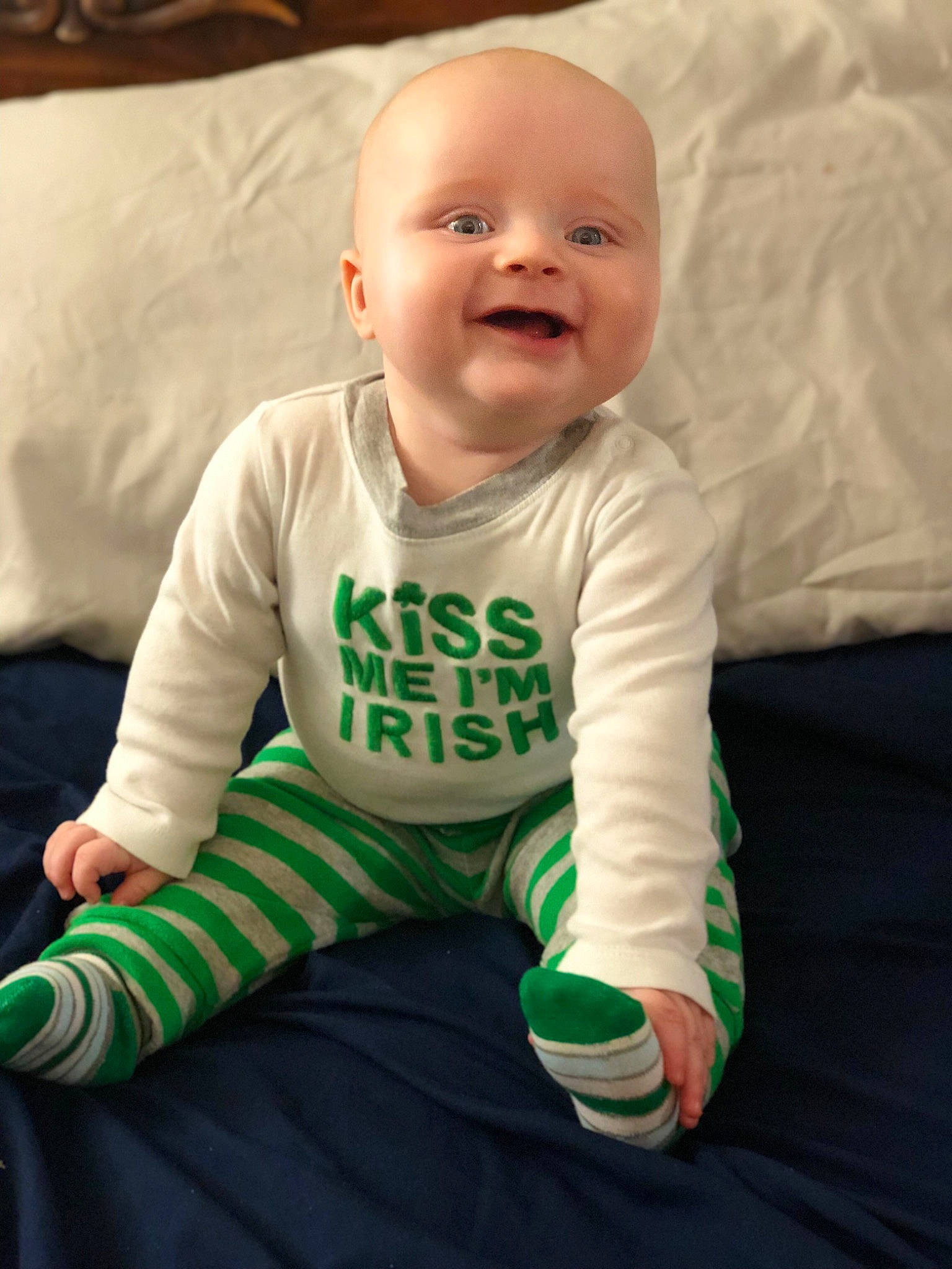 Braeden joined the competition — help win amazing prizes! baby, baby_products, baby_toddler_clothing, child, face, facial_expression, green, head, person, sitting, skin, sleeve, smile, t_shirt, toddler, tummy_time