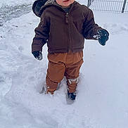 Levi joined the competition — help win amazing prizes! child, snow, winter, hat, jacket, gloves, boots, outdoor, cold, fence, backyard, curious, blue_eyes, clothing, person, snowy_ground, standing, nature, daylight, casual