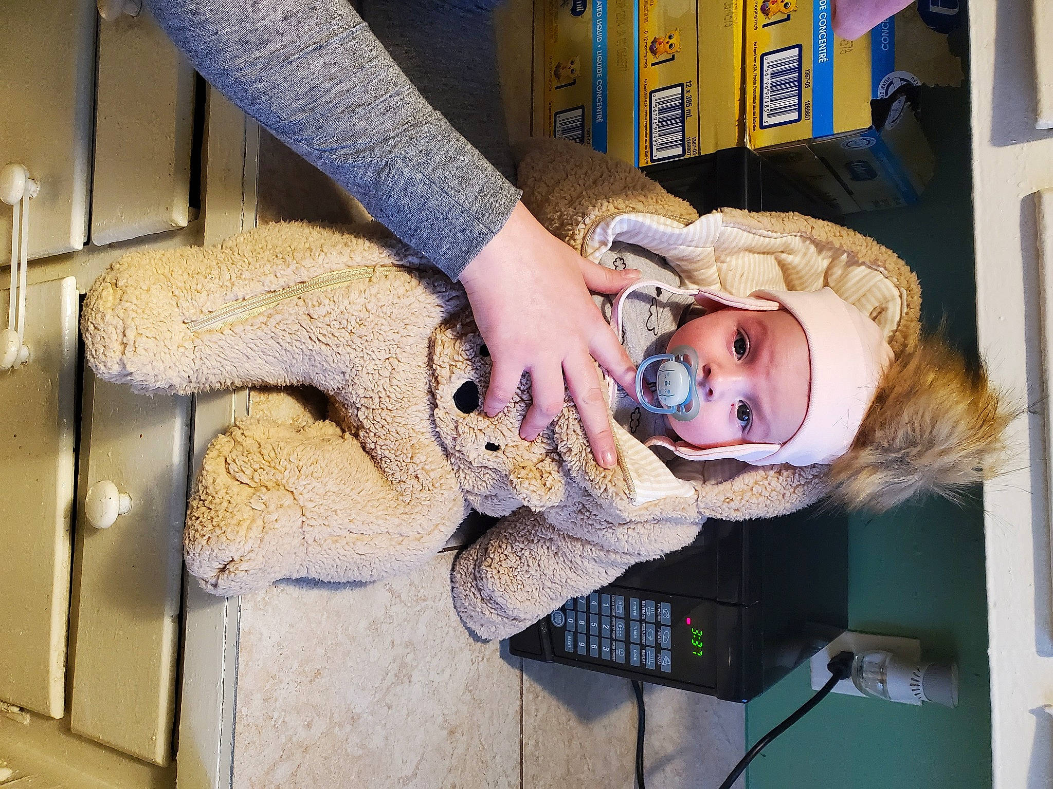 Tiffany is registered to the contest to win money with this photo: child, comfort, doll, eyelash, eyewear, fashion_design, fawn, fur, headwear, machine, mammal, person, room, sitting, stuffed_toy, sunglasses, toy, wood, wrist