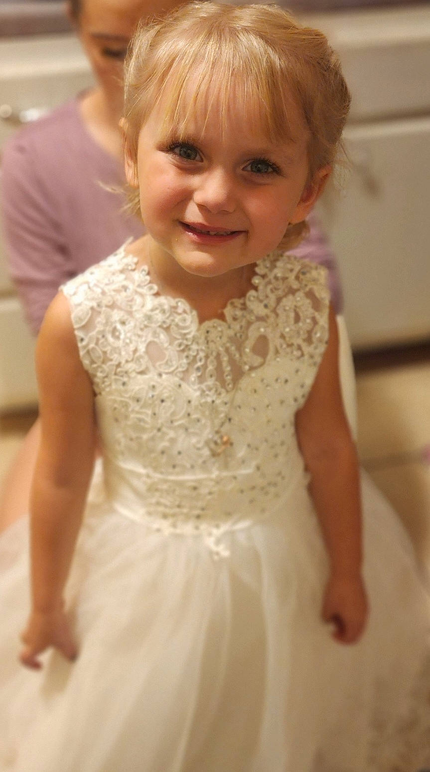 Airabella is registered to the contest to win money with this photo: baby_toddler_clothing, bridal_accessory, bridal_clothing, bridal_party_dress, dress, embellishment, flooring, formal_wear, gown, hair, hairstyle, happy, head, iris, joy, neck, person, skin, sleeve, smile