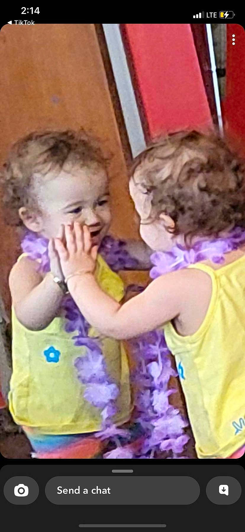 Novalynn is registered to the contest to win money with this photo: baby_toddler_clothing, cheek, facial_expression, fun, gesture, hairstyle, happy, head, human, interaction, iris, mammal, nose, person, pink, purple, shoulder, skin, sleeve, standing