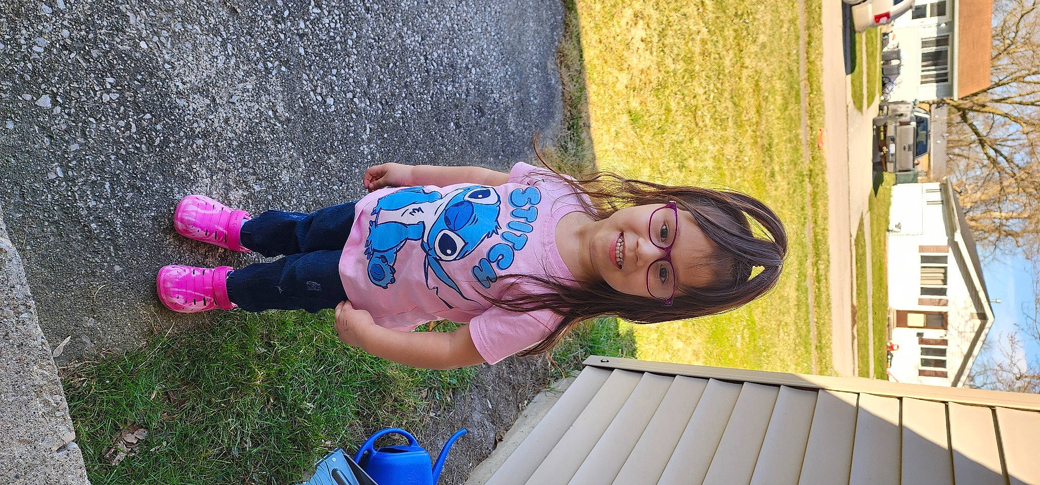 Genesis is registered to the contest to win money with this photo: blue, denim, electric_blue, eyewear, fun, grass, happy, human_leg, joy, leisure, magenta, people_in_nature, person, purple, recreation, sitting, toddler, tree, wood