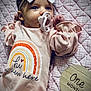 October joined the competition — help win amazing prizes! baby, infant, pacifier, headband, bow, pink, quilt, blanket, one_month_marker, milestone, newborn, clothing, cute, portrait, lying_down, soft_lighting, small_hands, face, baby_girl, cozy