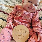Elizabeth joined the competition — help win amazing prizes! baby, blanket, clothing, cushion, dress, face, furniture, happy, head, homedecor, laughing, newborn, pajamas, person, photography, portrait, quilt, sitting, smile, t_shirt