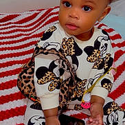 Tiana joined the competition — help win amazing prizes! toddler, child, baby, sitting, blanket, red_and_white_stripes, clothing, minnie_mouse, patterned_outfit, hair_bows, orange_bows, cute, phone, handbag, indoor, portrait, person, fashion, curious, accessory