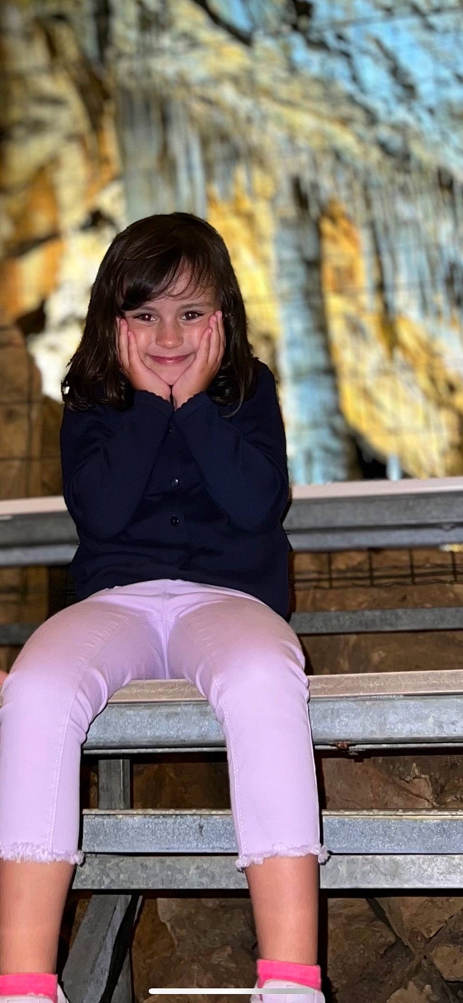 Chloé participe au concours pour gagner de l'argent avec cette photo : black_hair, chin, clothing, eye, face, flash_photography, hair, happy, head, human_body, joy, leg, lip, neck, outerwear, person, purple, skin, sleeve, smile