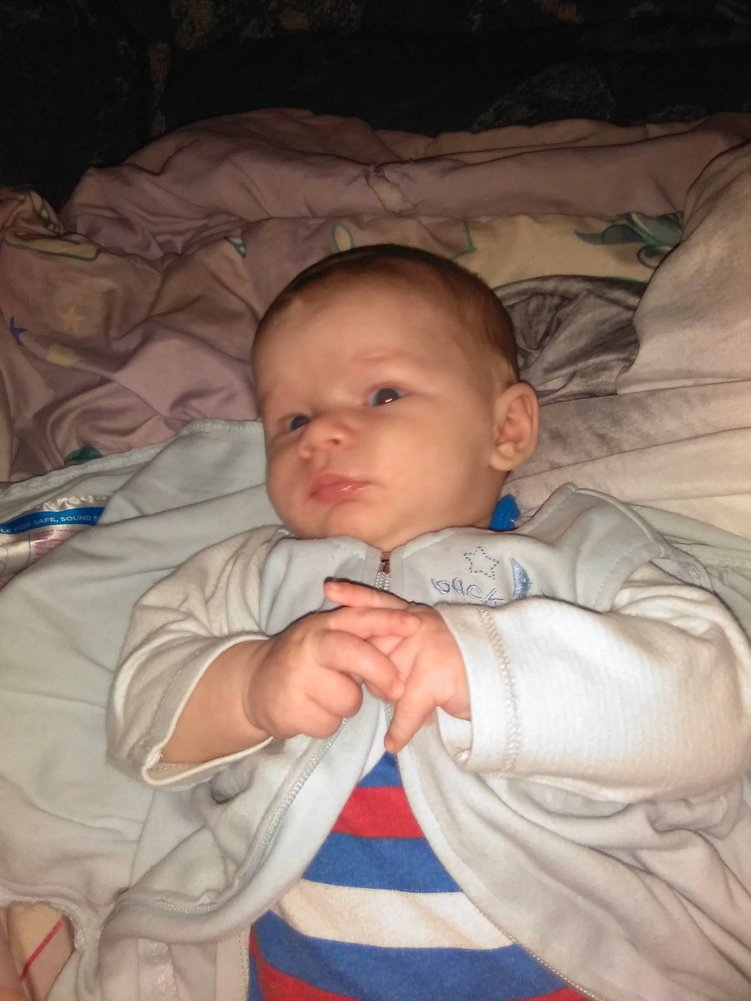 Jacob is registered to the contest to win money with this photo: baby, cheek, child, comfort, ear, eye, eyebrow, fun, gesture, hair, hairstyle, head, iris, linens, mouth, nose, person, skin, sleeve, thumb