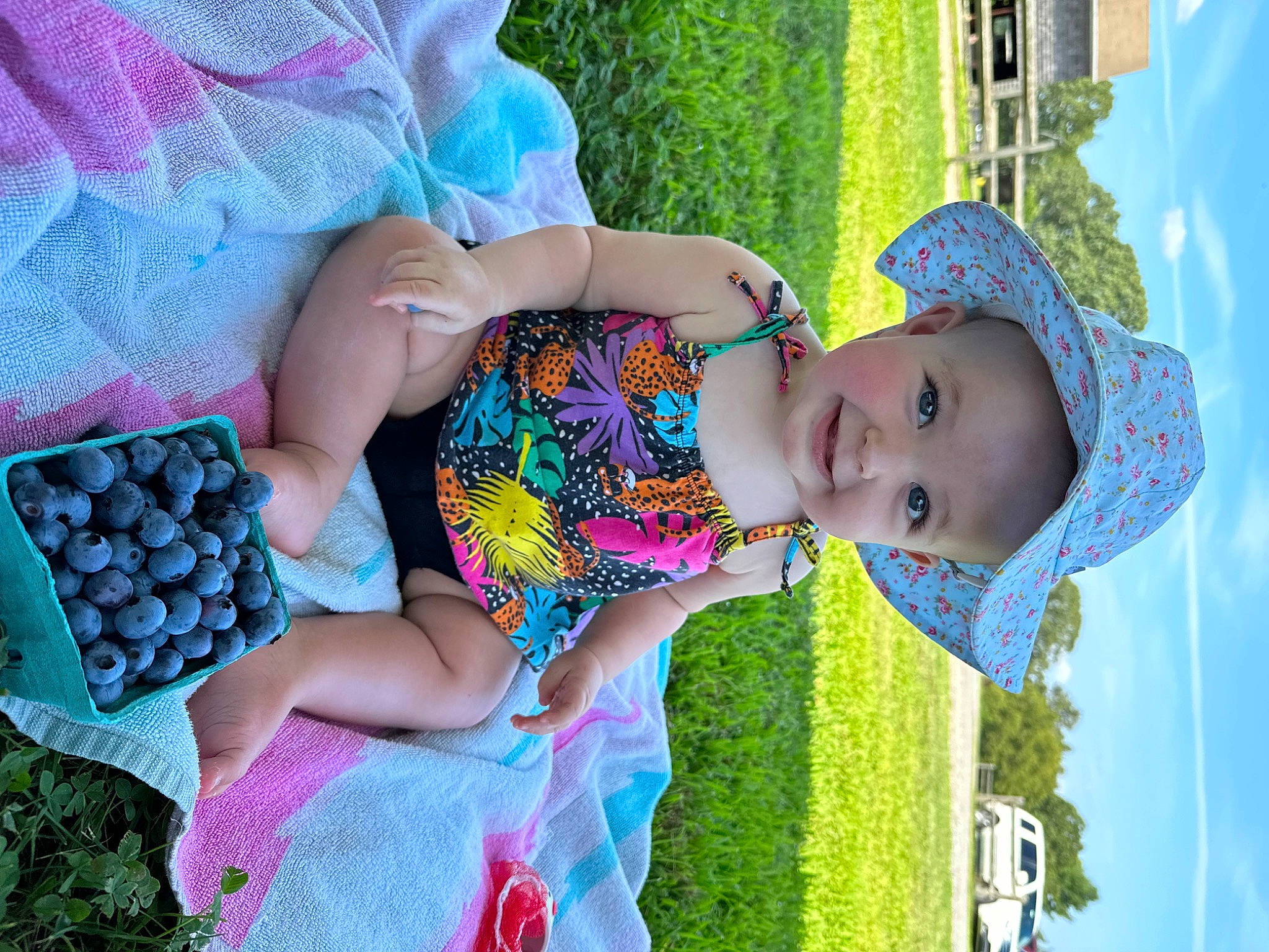 Sadie is registered to the contest to win money with this photo: baby, baby_toddler_clothing, blue, child, cloud, fun, grass, green, happy, joy, leisure, people_in_nature, person, pink, product, sky, smile, summer, textile, toddler