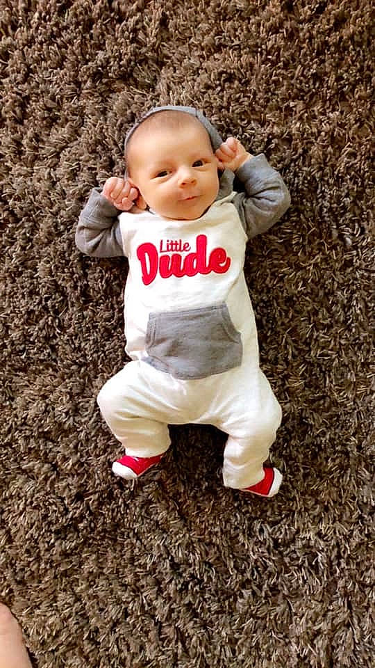 Kamdyn is registered to the contest to win money with this photo: baby, baby_toddler_clothing, child, eye, flash_photography, flooring, fun, fur, gesture, grass, happy, people_in_nature, person, play, portrait_photography, sitting, sleeve, smile, soil, toddler