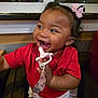 Elodie joined the competition — help win amazing prizes! baby, child, smile, laughing, pacifier, pink_bow, red_shirt, indoor, window, seat, cute, happy, young_child, person, infant, clothing, hand, face, expression, joy