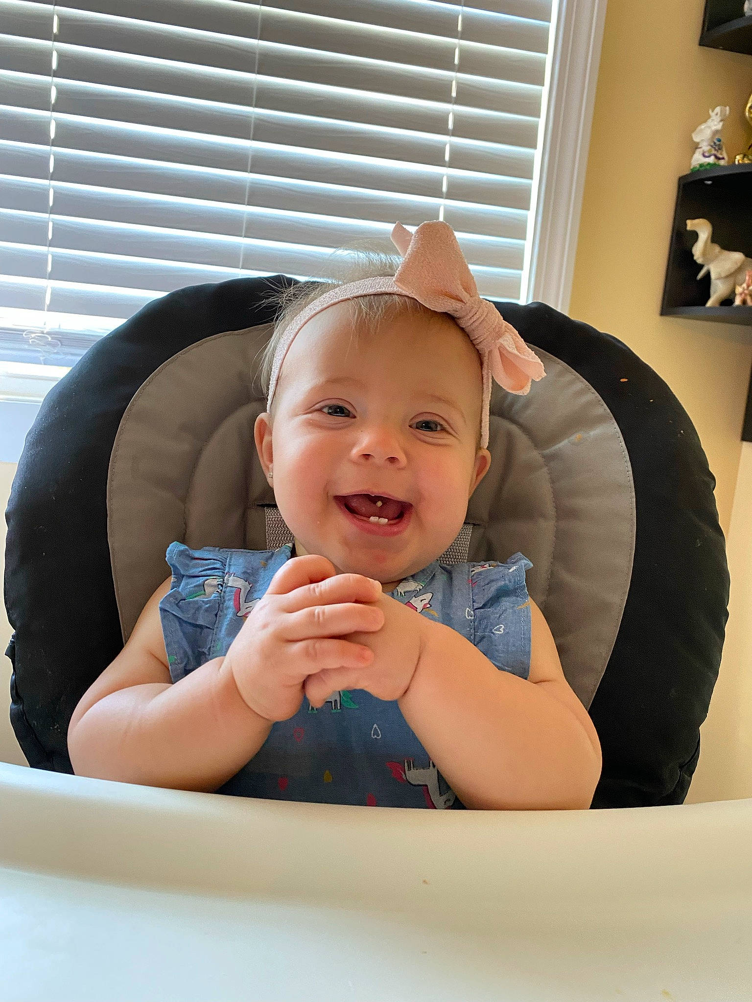 Maliyah is registered to the contest to win money with this photo: arm, baby, baby_toddler_clothing, child, comfort, facial_expression, finger, fun, hairstyle, hand, happy, person, room, sitting, skin, smile, t_shirt, thumb, toddler, window
