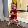 Jack joined the competition — help win amazing prizes! toddler, child, smiling, indoor, sneakers, maroon, toy, yellow, shorts, shirt, mirror, floor, carpet, wall, doorframe, happy, playful, person, portrait, casual
