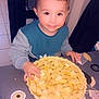 apple_pie, baking, butter, child, cooking, face, food_preparation, hands, happy, homemade, indoor, kitchen, pie_crust, portrait, sitting, smiling, table, tablecloth, toddler, young_child
