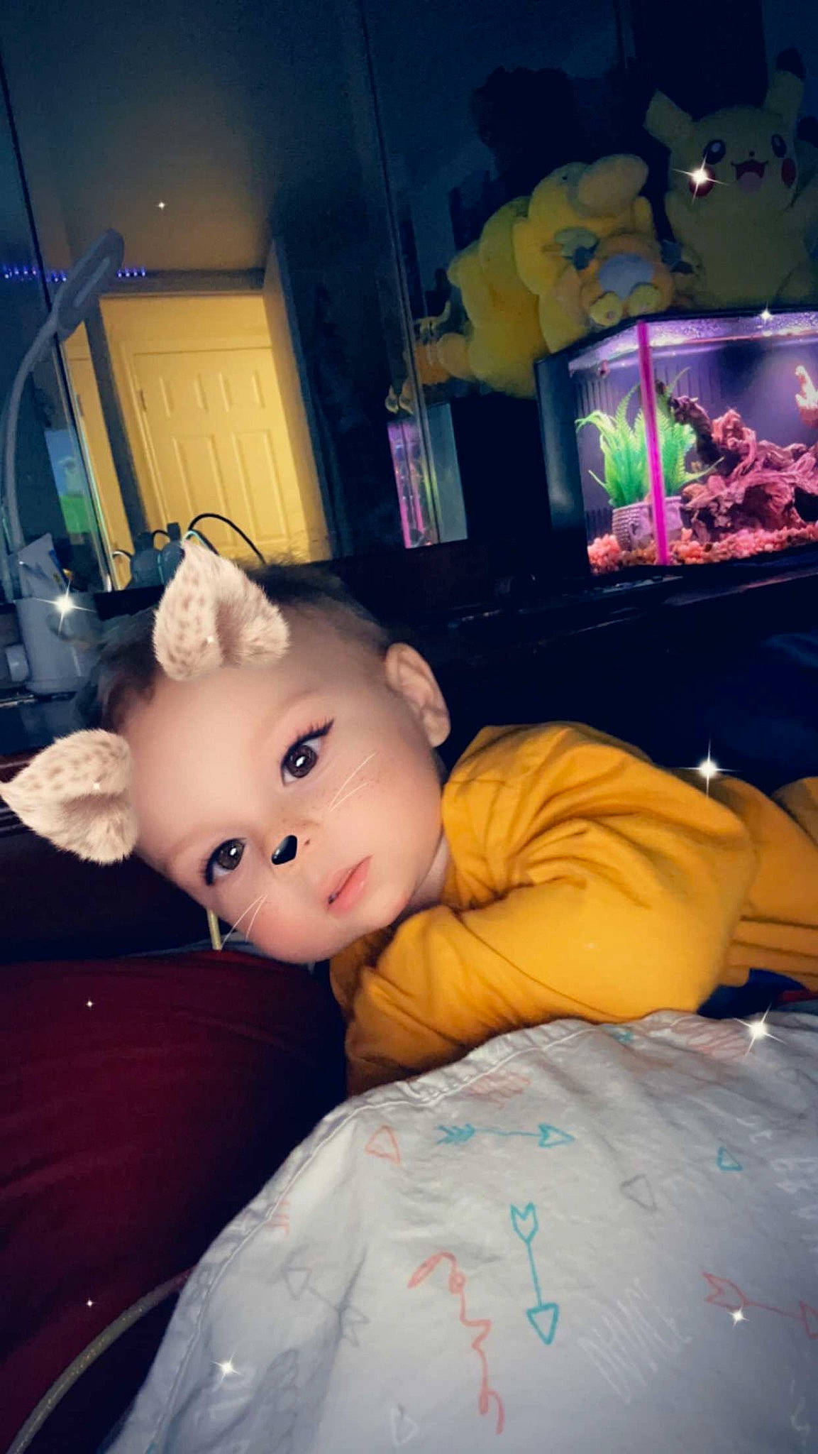 Mason joined the competition — help win amazing prizes! bed, bedding, child, comfort, display_device, doll, fun, fur, happy, linens, person, pillow, plush, room, selfie, sitting, stuffed_toy, t_shirt, television_set, toy