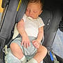 Jahkarri is registered to the contest to win money with this photo: baby, newborn, sleeping, car_seat, infant, clothing, sock, pacifier, blanket, child, person, cute, resting, indoor, soft, peaceful, head, hand, legs, comfort