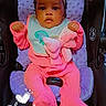 baby, infant, child, car_seat, pink_outfit, headband, bow, bib, pacifier, sitting, portrait, face, eyes, serious_expression, indoors, vehicle, safety_harness, blanket, date_stamp, photography