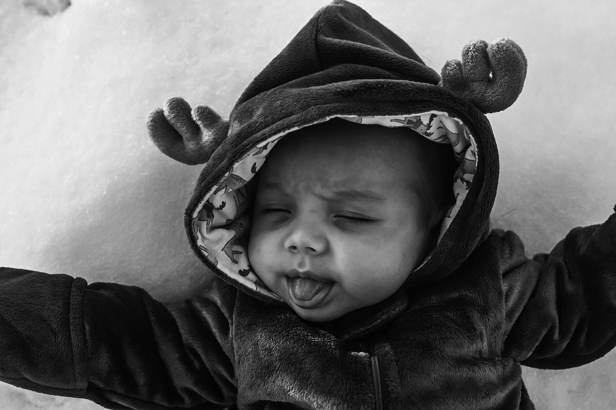 Sheldon is registered to the contest to win money with this photo: black, black_and_white, cheek, clothing, eye, face, gesture, hand, happy, head, headwear, iris, mouth, nose, organ, outerwear, person, photograph, skin, smile