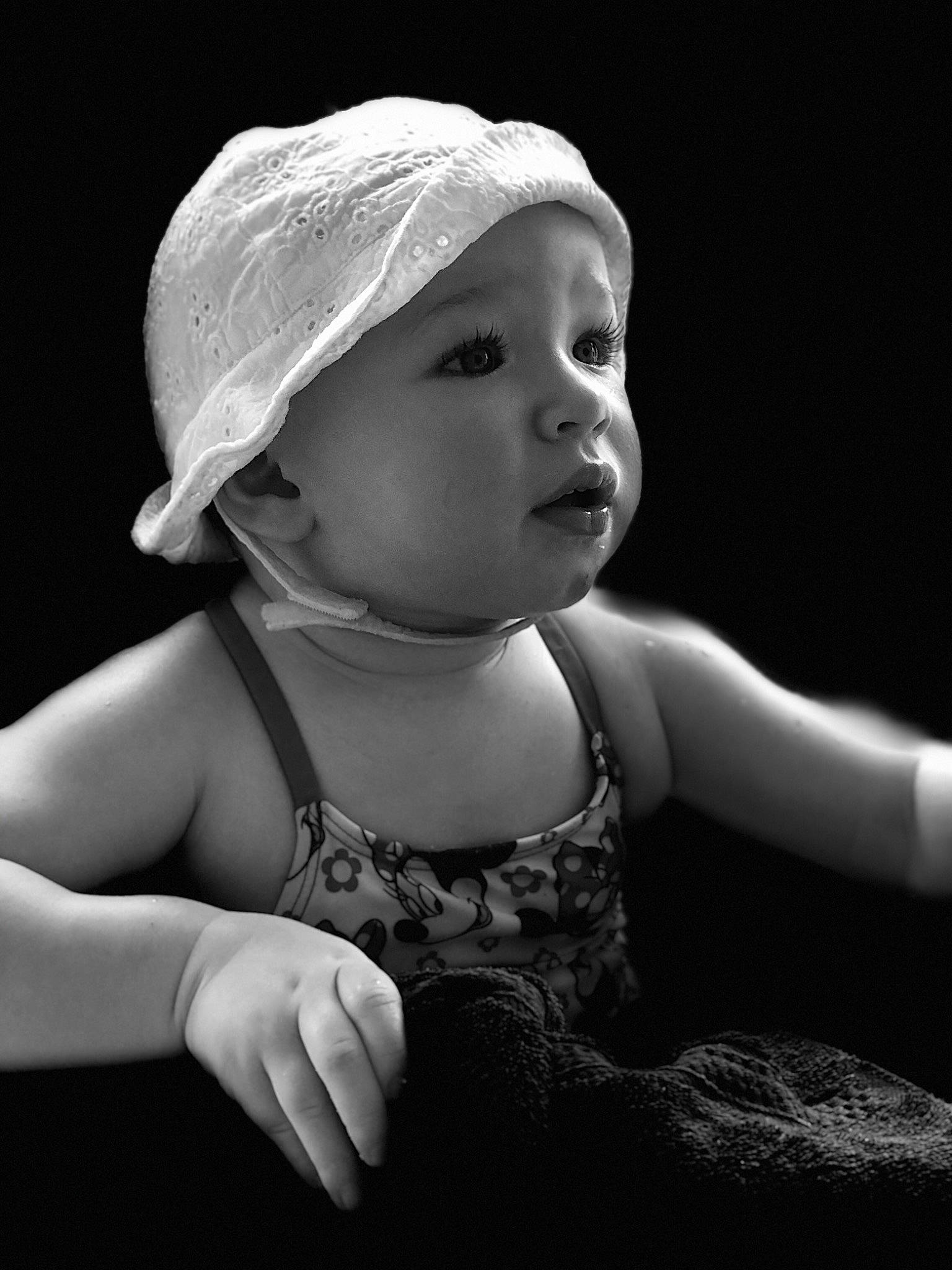 Clara is registered to the contest to win money with this photo: baby, black, black_and_white, child, child_model, flash_photography, hand, headgear, headwear, monochrome, monochrome_photography, person, photograph, photography, portrait, portrait_photography, skin, smile, stock_photography, style