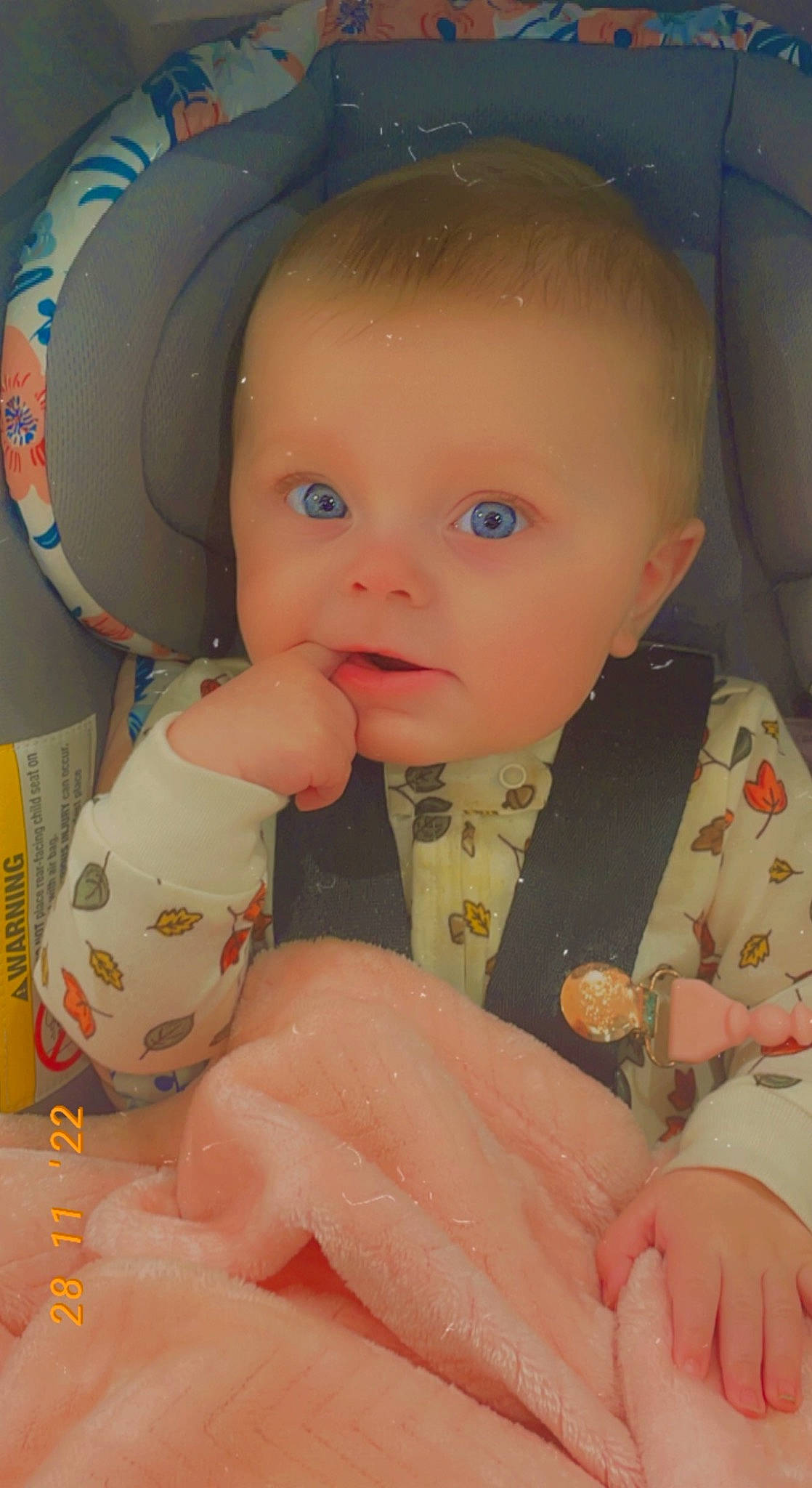 Rosalie is registered to the contest to win money with this photo: baby, baby_products, baby_toddler_clothing, cheek, child, comfort, eye, finger, hand, iris, lip, mouth, nail, nose, person, pink, skin, sleeve, smile, thumb