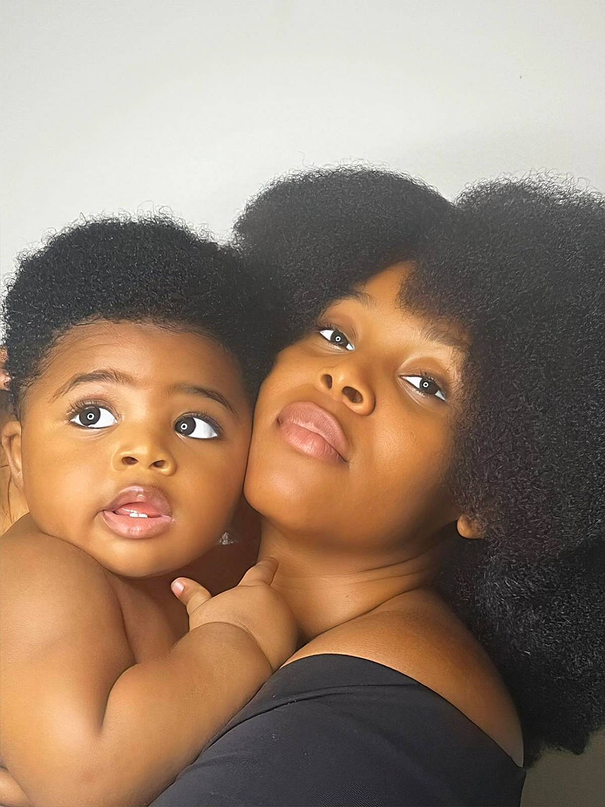 Ian is registered to the contest to win money with this photo: afro, black_hair, cap, cheek, child, chin, eye, eyebrow, eyelash, face, flash_photography, forehead, gesture, happy, head, jewellery, lip, nose, person, skin