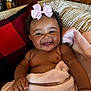 Zalayna joined the competition — help win amazing prizes! baby, blanket, cheeks, child, couch, cozy, curly_hair, cute, drool, happy, indoors, infant, pillow, pink_bow, portrait, red_and_black, relaxing, skin, smiling, toddler